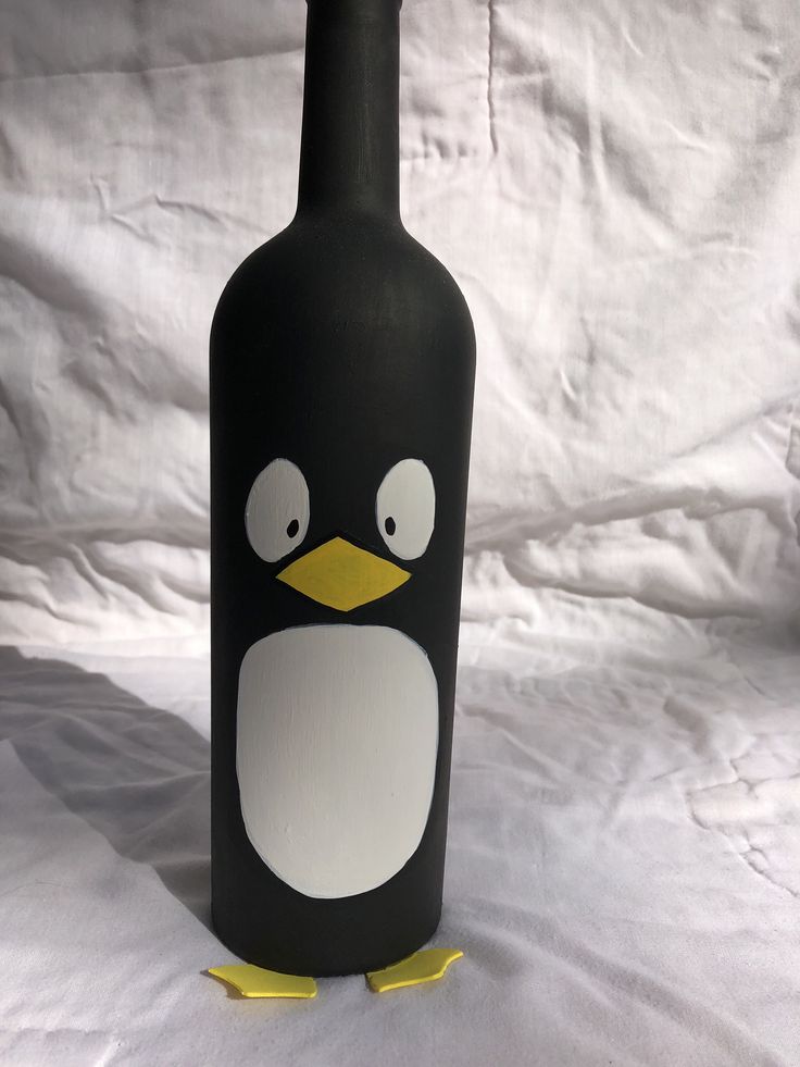 a bottle with a penguin face painted on it