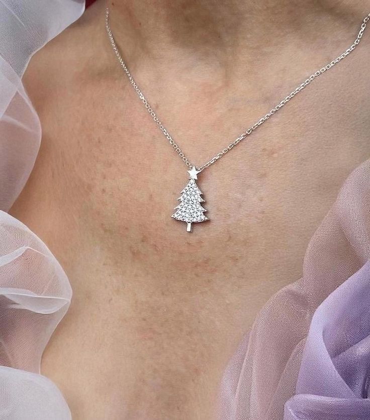 CHRISTMAS TREE NECKLACE 🎄 -Unique Necklace -Handmade -Sterling Silver 925 -Zircon -Platinum Fill It's perfect for getting into the festive mood! Ideal for a Christmas gift to yourself or someone you love! 💕 > MATERIALS     Gold 18K,14K,12K     Sterling Silver 925  > RING SIZE    All my rings are US standard size,in case you do now know whats your ring size you could also go to your local jewelry store to measure     your finger size to get your correct ring size. Please contact me for the ring size details before placing the order.  > PACKAGING    All of our products are beautifully packaged for gifts in a jewelry box.    All of our engagement rings are packaged in PREMIUM jewelry boxes for free. > ADDITIONAL SERVICE    Engraving Service    All sizes    Costum order    > Custom Order We New Years Jewelry, Christmas Tree Necklace, Order Packaging, Holiday Necklace, Premium Jewelry, Christmas Pendant, Tree Necklace, Local Jewelry, 925 Ring