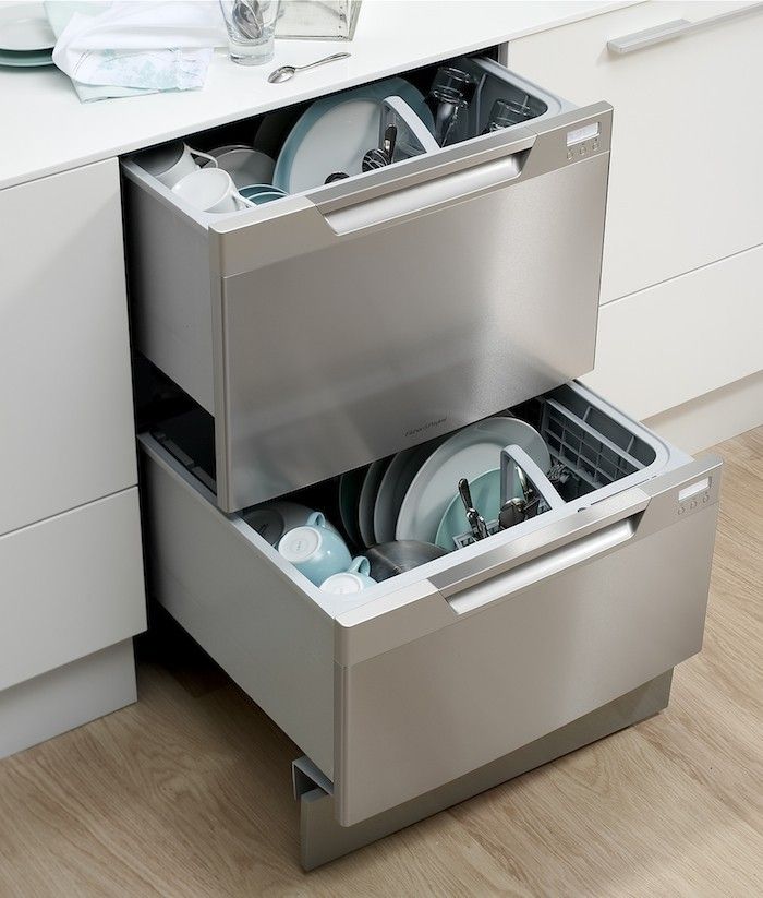 an open dishwasher drawer in a kitchen