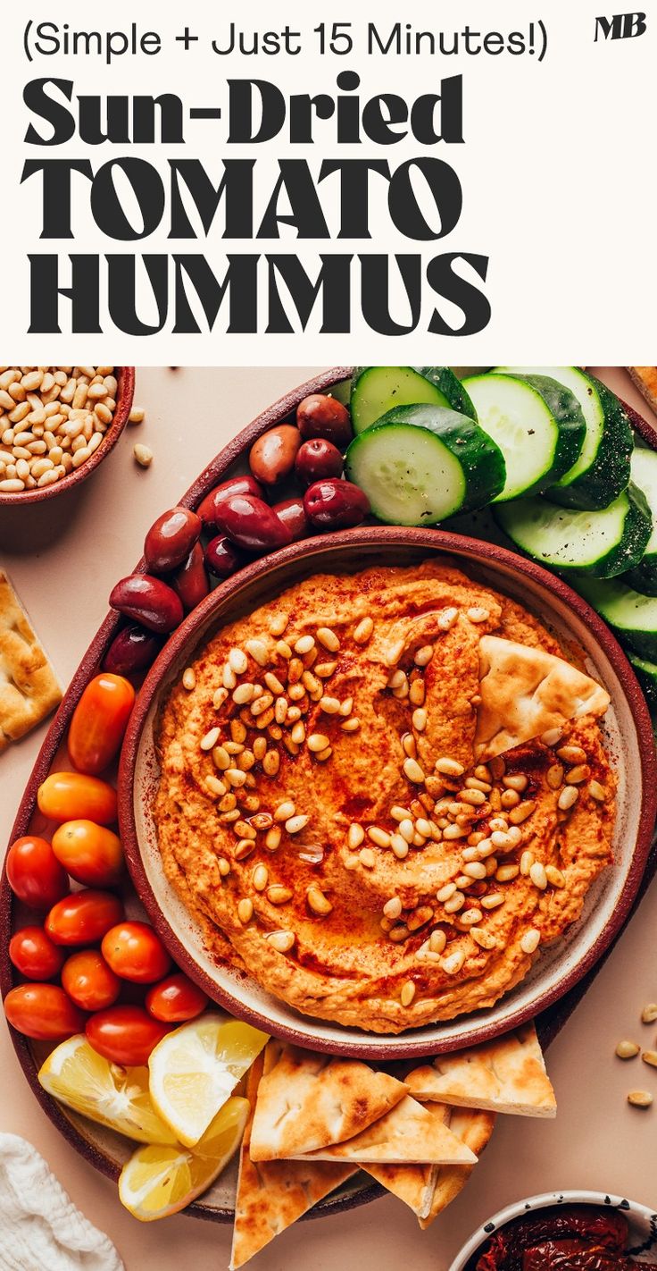 a plate full of hummus, cucumbers and other food items with the title sun - dried tomato hummus