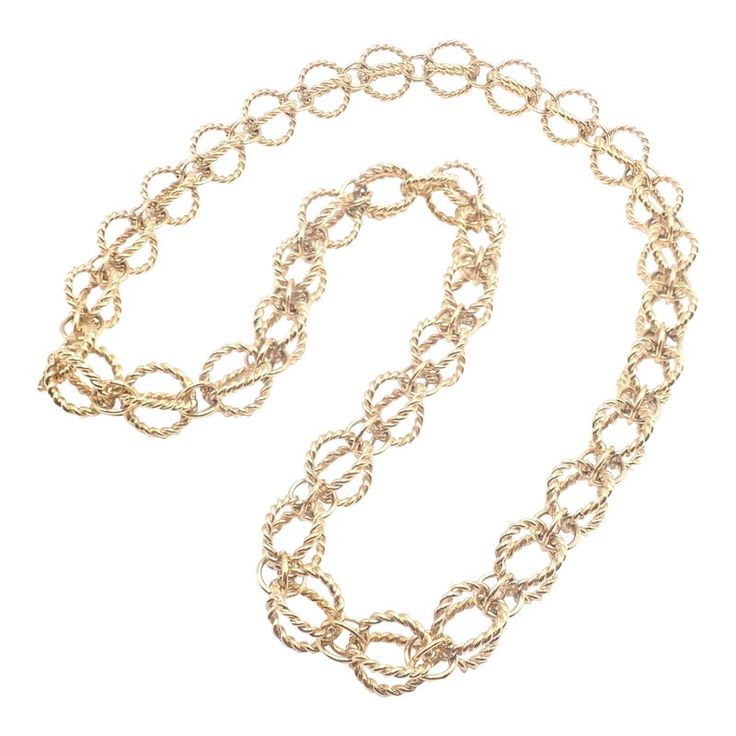 Tiffany & Co Schlumberger Circle Rope 18k Yellow Gold Long 23" Link Necklace   About Jean Schlumberger: Tiffany's celebrated jewelry designer, Jean Schlumberger (1907-1987), was born in Alsace, France. During the 1920s in Paris, Schlumberger's genius was quickly recognized. His original and eclectic designs became the rage among his friends, including Marina the Duchess of Kent and Diana Vreeland. Elsa Schiaparelli, the famed dress designer, engaged him to accessorize her new collections with buttons and costume jewelry. In 1956, Jean Schlumberger joined Tiffany & Co., where he had the freedom to explore uncharted territory, mixing yellow beryls, amethysts, emeralds, sapphires and aquamarines in mountings of yellow gold to create classic pieces such as the "Bird of Paradise" clip. A great Luxury Gold Long Chain Necklace, Gold Hallmarked Necklaces For Evening, Yellow Gold Party Chain Necklace, Yellow Gold Round Chain Necklace For Party, Gold-tone Long Necklace For Formal Occasions, Yellow Gold Formal Necklace, Formal Yellow Gold Long Chain Necklace, Gold Long Chain Necklace For Evening, Gold Long Necklace For Evening