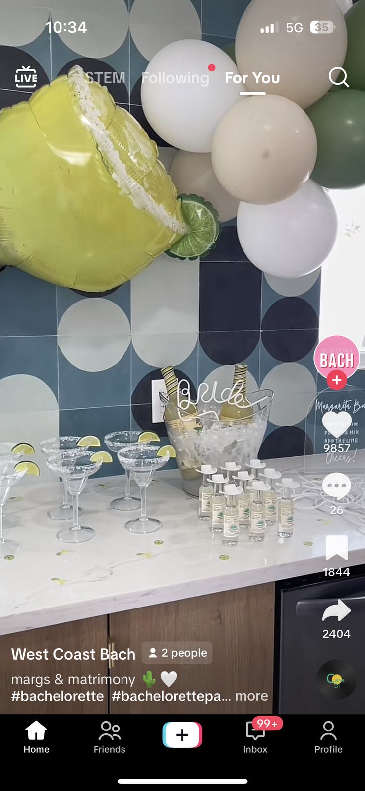 an image of a party setting with balloons and champagne glasses on the counter top in front of it