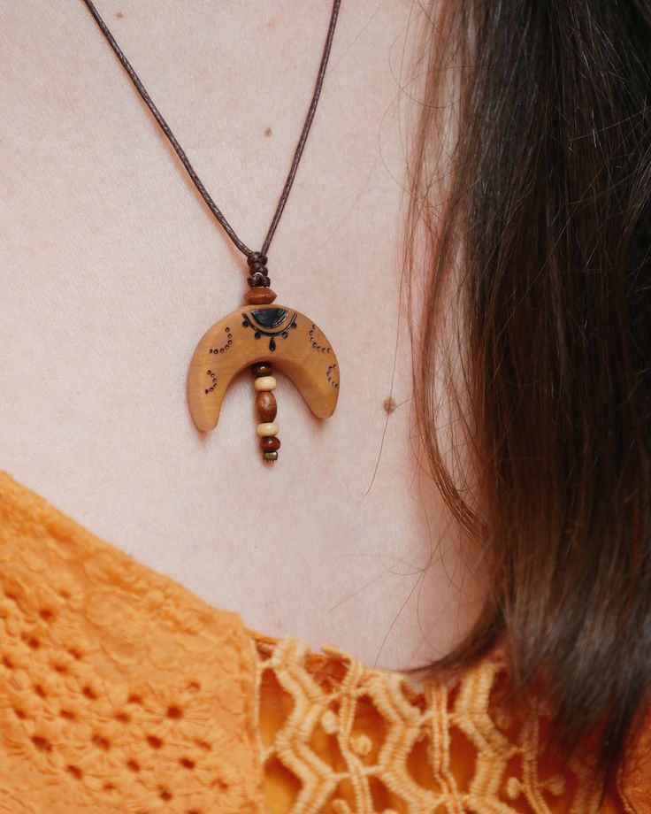 A handmade halfmoon necklace. The pendant is made of local birch wood. A piece of nature for you. Each piece of wood is unique. Therefore, the shape of your delivered necklace may differ slightly from the product images.  After sawing the tree slices, the wood is finely sanded and drilled. I burn the design into the wood by hand and treat it with a natural oil mixture. The oil protects the pendant from external influences and keeps it looking beautiful for a long time. Still, you should take off Bohemian Natural Wood Necklaces As Gift, Bohemian Natural Wood Necklace As Gift, Bohemian Crescent Necklace For Festivals, Handmade Moon Shaped Nature-inspired Necklace, Handmade Bohemian Half Moon Necklace, Bohemian Half Moon Necklace With Moon Phase, Bohemian Half Moon Phase Necklace, Handmade Moon-shaped Bohemian Necklace, Handmade Bohemian Moon Necklace