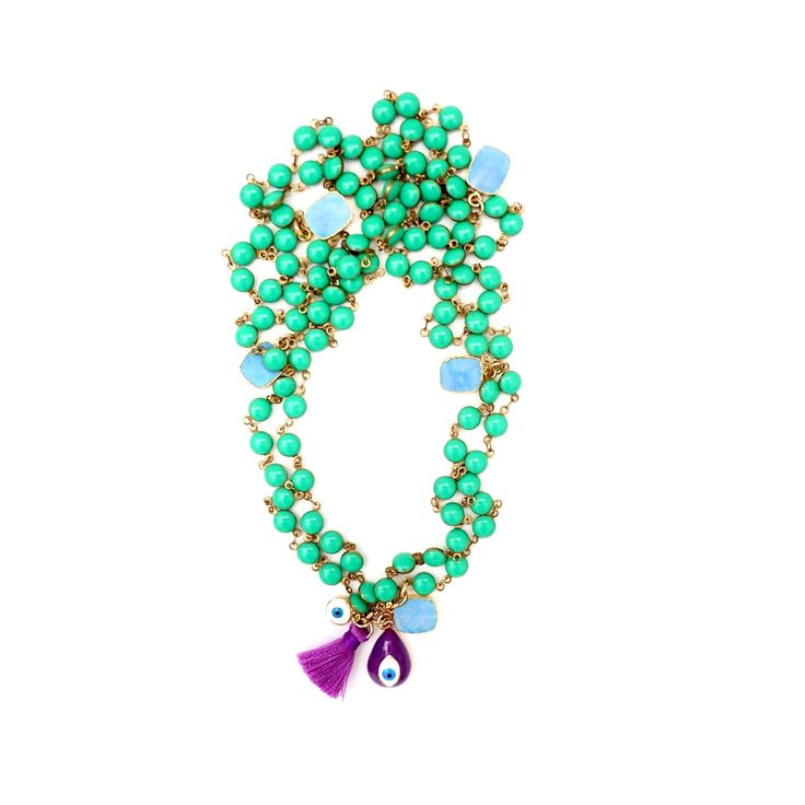 Handcrafted truly one-of-a-kind unique necklace, a vintage chain with gorgeous green enamel stones, little square shaped turquoise charms throughout, enamel purple tear drop shape evil eye pendant, silk tassel and a tiny evil eye charm. Wear it long, doubled or tripled in any way creative way you like. Necklace is 38" in length Variety of different charms Vintage enamel chain Made with love in Los Angeles Complimentary gift wrapping provided All sales final. Green Spiritual Necklace For Festival, Green Spiritual Necklace For Festivals, Green Charm Necklace With Dangling Charms For Gift, Green Jewelry With 108 Beads For Festival, Bohemian Green Chrysoprase Jewelry, Green Dangling Charms Jewelry, Green Dangle Charm Necklace, Green Dangle Charm Necklaces, Green Dangle Jewelry With Charms