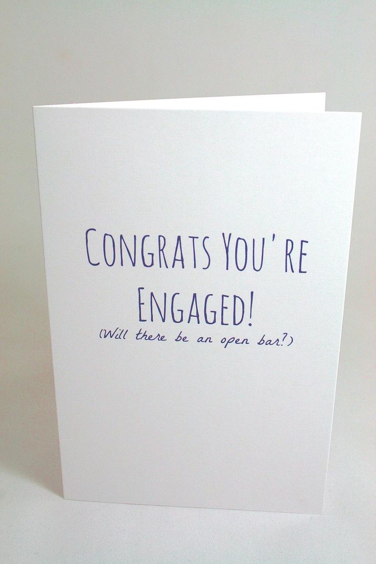 a white card with the words congrats you're engaged written on it