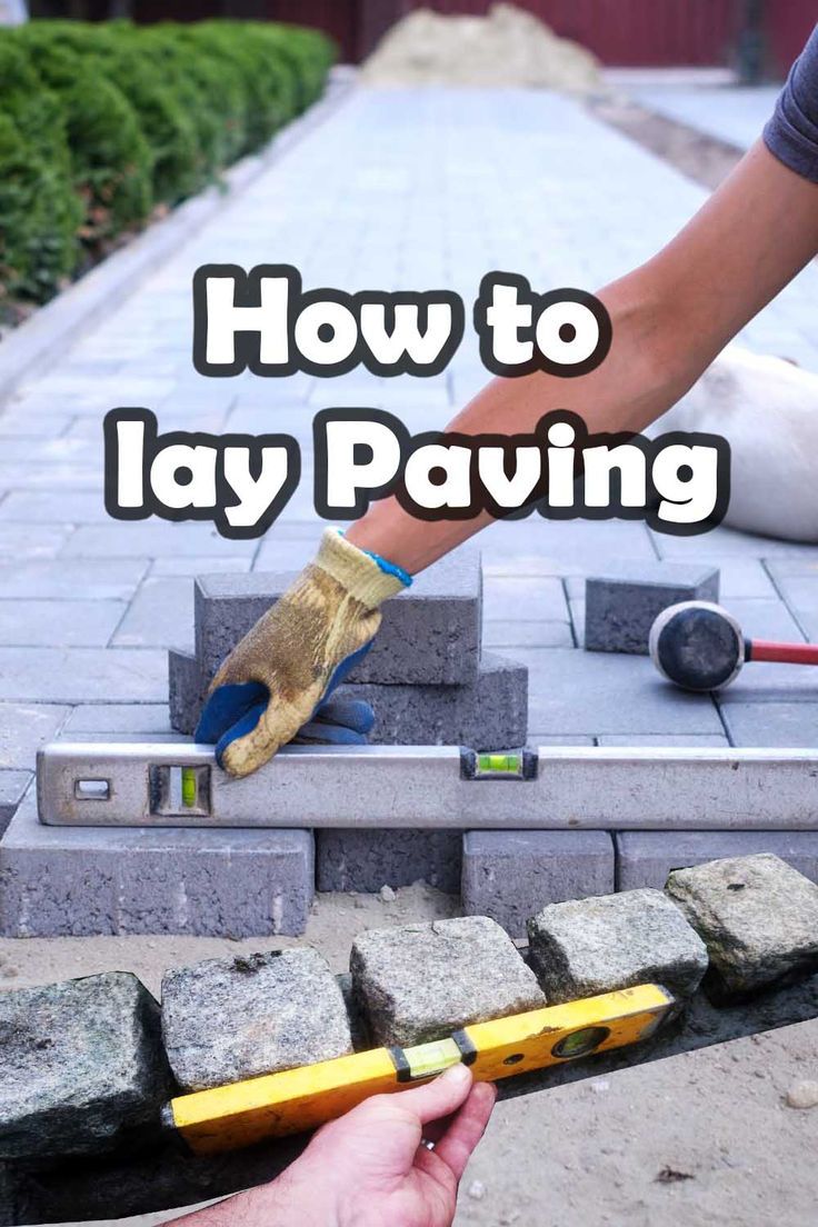 a person is using a hammer to lay paving on concrete blocks with the words how to lay paving in front of them