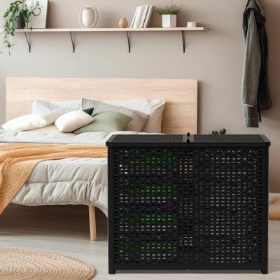 a bed room with a neatly made bed and shelves