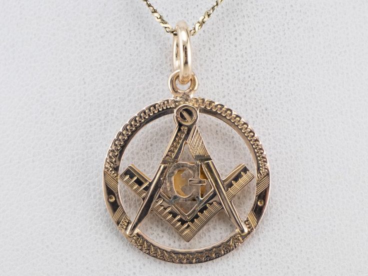 Wonderful details in the gold make this Masonic pendant an outstanding piece of workmanship. The condition is also excellent, and this piece will be a treasured favorite for years to come. This pendant does not come with the chain shown. Please feel free to contact us, we will help you find the perfect chain for your style and budget! Metal: 14K Yellow Gold Measures: 21 x 30 mm, with bail Gold Square Pendant Jewelry For Formal Occasions, Antique Engraved Square Pendant Jewelry, Gold Square Pendant Fine Jewelry, Fine Jewelry Gold Square Pendant, Gold Fine Jewelry With Square Pendant, Symbolic 14k Gold Diamond-cut Jewelry, Symbolic 14k Gold Diamond Cut Jewelry, Symbolic 14k Gold Jewelry With Diamond Cut, Collectible Gold Square Pendant Jewelry