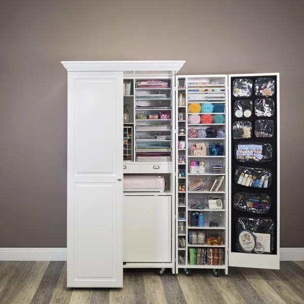 a white refrigerator freezer sitting inside of a kitchen next to a wooden floor and wall