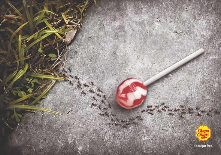 a red and white lollipop with the words made in china on it