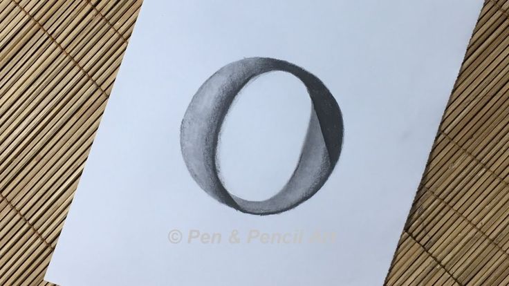 a piece of paper with an o drawn on it