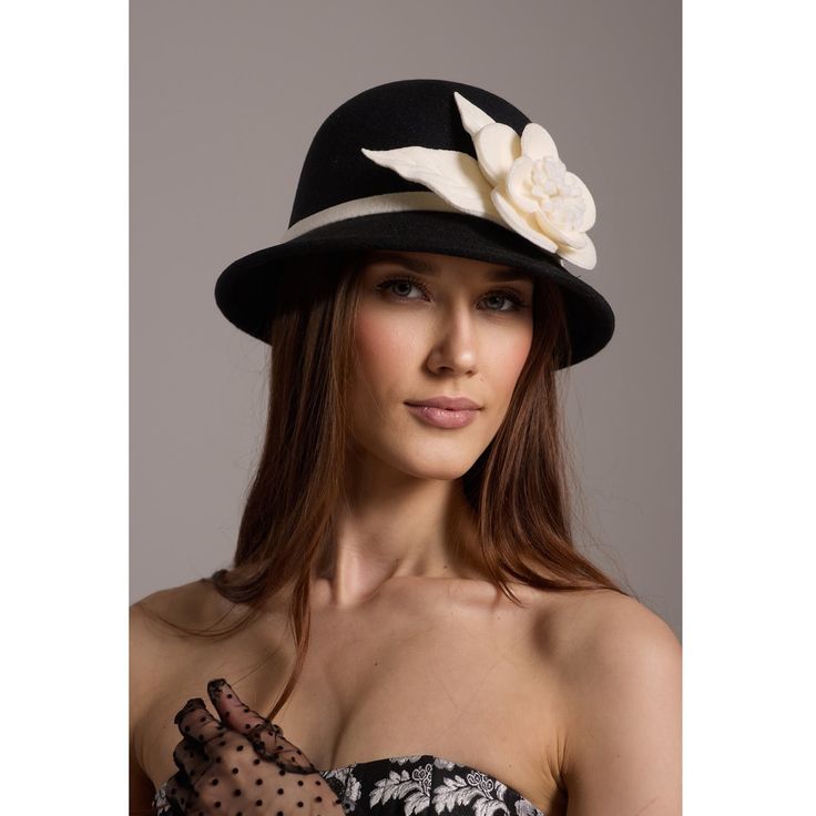 Our modern reinterpretation of the 1920s Scala hat, designed for the contemporary woman who appreciates timeless elegance with a hint of glamour. This sophisticated accessory offers a comfortable fit and a sleek monochrome color palette, perfect for elevating any ensemble with effortless style. Woven pearl bag with a cotton pouch inside. Wipe clean with a cloth. Chic Wide Brim Fedora, Gatsby Style Wide Brim Evening Hat, Chic Curved Brim Fedora For Parties, Formal Brimmed Fedora, Classic Wide Brim Hat For Evening, Chic Cloche Hat With Short Brim, Gatsby Style Short Brim Cloche Hat For Party, Elegant Adjustable Mini Hats For Winter, Evening Gatsby Hat With Short Brim