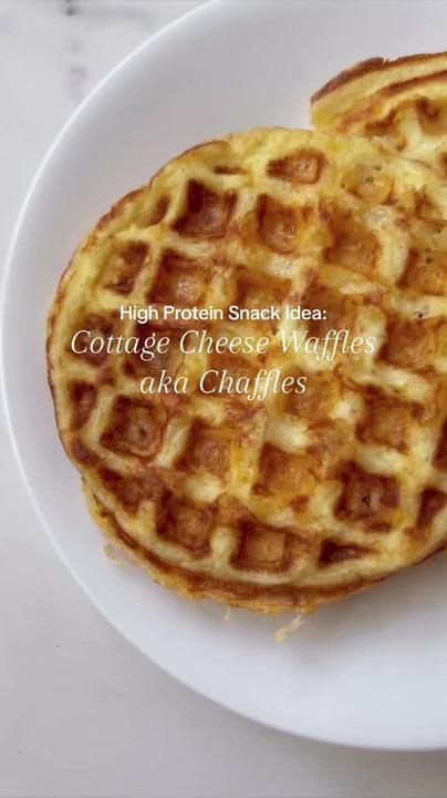 two waffles sitting on top of a white plate