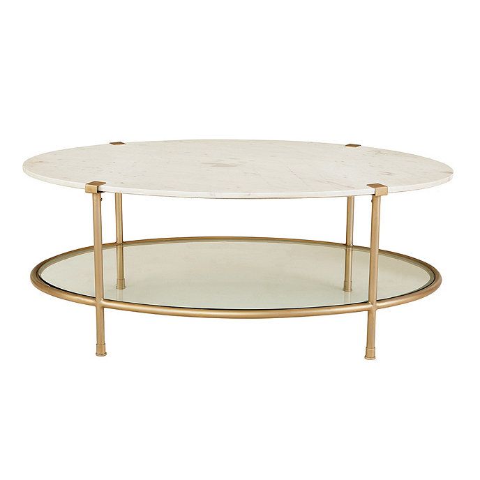 a white marble and gold coffee table with two circular trays on each side, against a white background