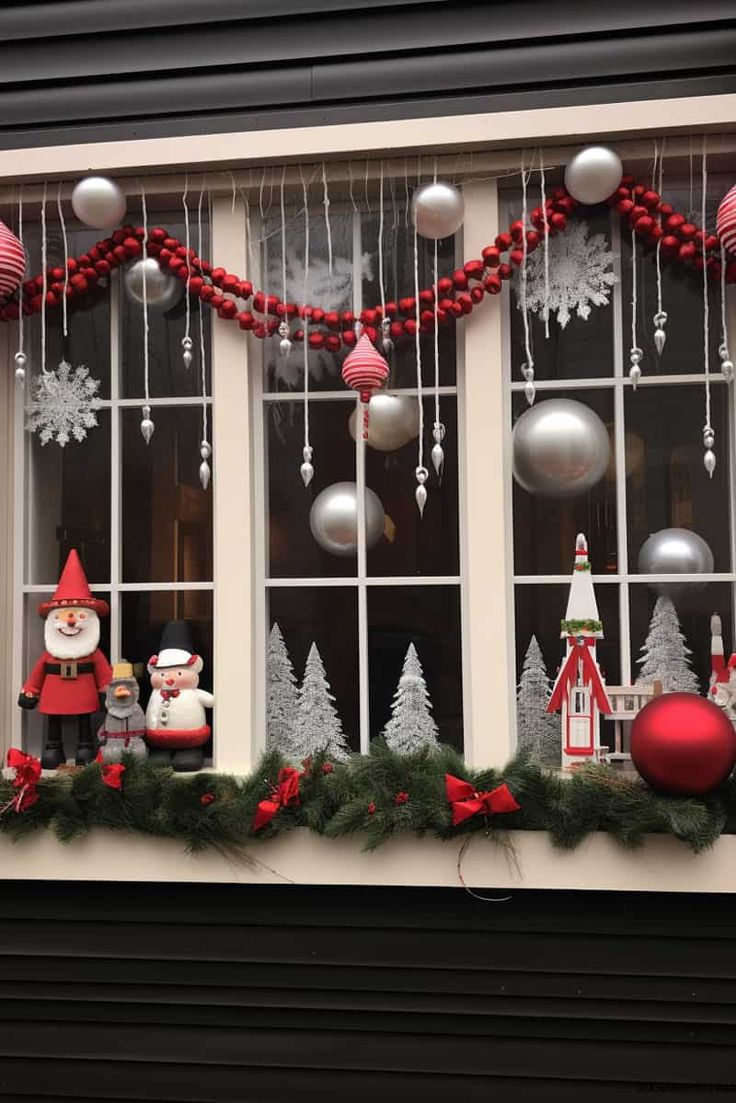 a window decorated with christmas decorations and ornaments