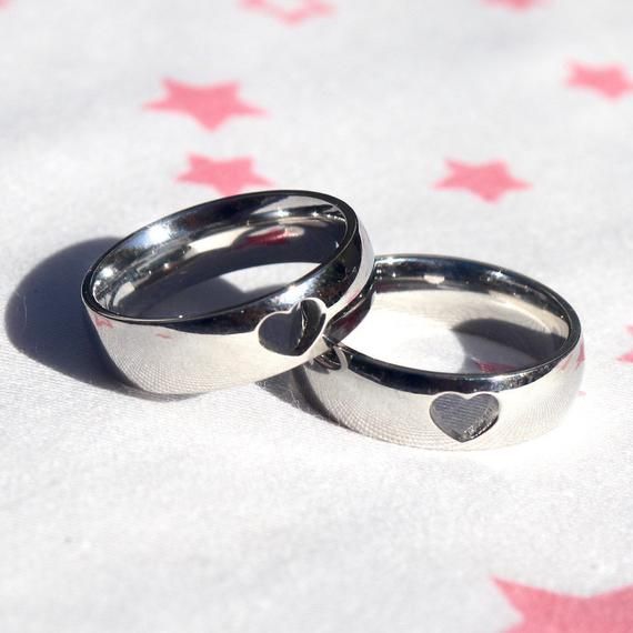 Stainless steel matching heart rings. Perfect for couples, best friends or even YOURSELF !!!! LISTING COMES WITH 2 RINGS!Sizes of your choice! For example if you are a size 8 and your partner is a size 10!Select the sizes in the drop down menu and check out!Sizes are standard US SIZES! Rings are 100% STAINLESS STEEL!Won’t rust, tarnish, or turn your finger green! Adjustable Heart-shaped Couple Rings For Valentine's Day, White Gold Couple Rings For Valentine's Day, Valentine's Day Couple Rings In White Gold, Valentine's Day Couple Rings Gift, Adjustable Couples Rings For Valentine's Day, Stainless Steel Promise Rings For Valentine's Day, Adjustable Heart-shaped Couple Rings For Promise, White Gold Couple Rings For Anniversary On Valentine's Day, Valentine's Day Promise Ring In Stainless Steel