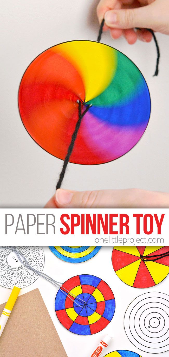 someone is making a spinner toy out of paper