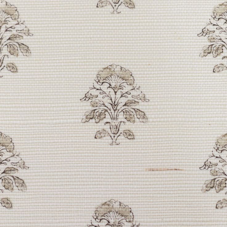 a white and brown wallpaper with an ornate design on the back half of it