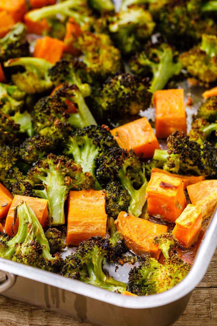 broccoli and sweet potatoes in a casserole dish on a wooden table