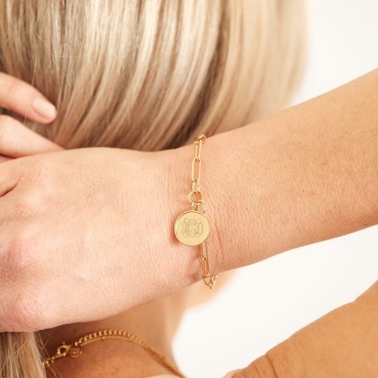 Treat yourself or someone special to our eternally best-selling Callie bracelet. Its chic chain link style is finished with an engravable disc pendant for the perfect everyday look. Available in 14k gold plated brass Pendant measures 5/8" 6" elongated link chain with 1" extender Lobster claw closure Made in the USA With engraving this item is FINAL SALE SKU: BYB1105 Timeless Paperclip Bracelet With Adjustable Chain As Gift, Timeless Chain Paperclip Bracelet For Gift, Timeless Paperclip Chain Bracelet As Gift, Timeless Paperclip Chain Bracelet Gift, Charm Link Chain Bracelet, Elegant Brass Charm Bracelet With Adjustable Chain, Link Chain Bracelet With Charms, Engraved Chain Link Jewelry Gift, Personalized Gift Bracelets With Adjustable Chain