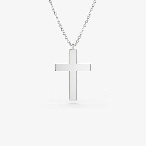 Gold KT: 14K Custom Gold Color: Rose Gold, Yellow Gold, White Gold Cross: 18 x 11 MM This 14k plain gold dangling cross necklace is a simple yet stunning accessory that will add a touch of sophistication to any outfit. The delicate gold chain holds a beautifully crafted cross charm that dances elegantly with every movement. Measuring approximately 18mm in size, this necklace is the perfect size for everyday wear, and the 14k gold construction ensures that it will last for years to come. Classic Sterling Silver Crucifix Necklace, Minimalist Cross Pendant Necklace For Formal Occasions, Classic Cross Pendant Necklace As Gift, Minimalist 14k Gold Crucifix Necklace, Minimalist Cross Pendant Jewelry For Formal Occasions, Minimalist Cross Pendant Jewelry For Formal Events, Classic White Gold Crucifix Necklace, Elegant Everyday Sterling Silver Cross Necklace, Classic White Gold Cross Necklace