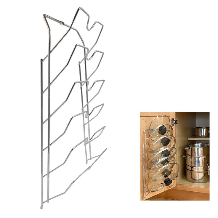 a rack with pots and pans in it next to an open drawer containing cooking utensils