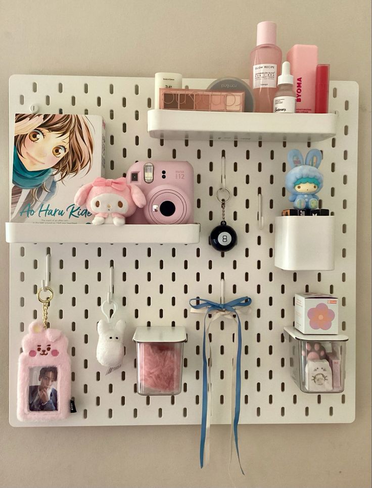 a white peg board with various items on it