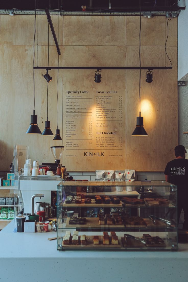 a bakery counter with lots of pastries on it