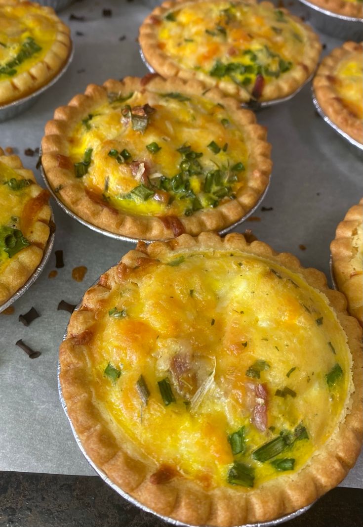 there are many pies on the tray ready to be baked in the oven together