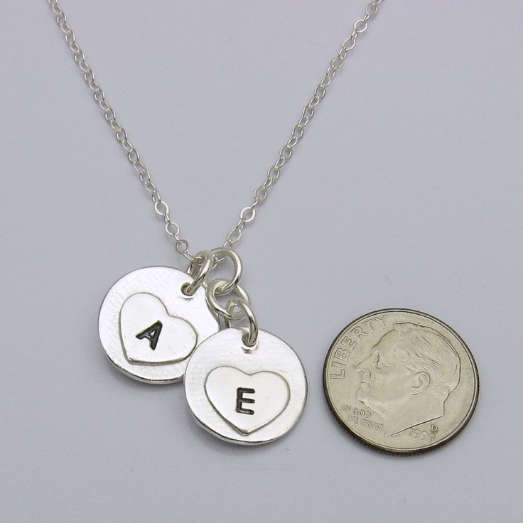 Keep your loved ones with you always, with this classic circle fingerprint with birthstone charm necklace. Handcrafted in solid sterling silver, this necklace features a beautiful circle fingerprint pendants hanging at different levels from your choice of chain. This trendy charm necklace design is both simple and elegant. The necklace is available with different charm sizes, different chains and different necklace lengths. With its durable construction and timeless design, this necklace is sure Stamped Sterling Silver Heart Pendant Necklace, Silver Hand Stamped Round Pendant Jewelry, Silver Hand-stamped Round Pendant Jewelry, Sterling Silver Hand Stamped Pendant Charm Necklace, Round Sterling Silver Nickel-free Charm Necklace, Everyday Sterling Silver Stamped Necklace, Heart Charm Jewelry For Anniversary Gift, Round Heart Charm Jewelry For Anniversary Gift, Sterling Silver Hand Stamped Pendant