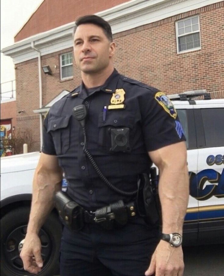 a police officer standing in front of a building