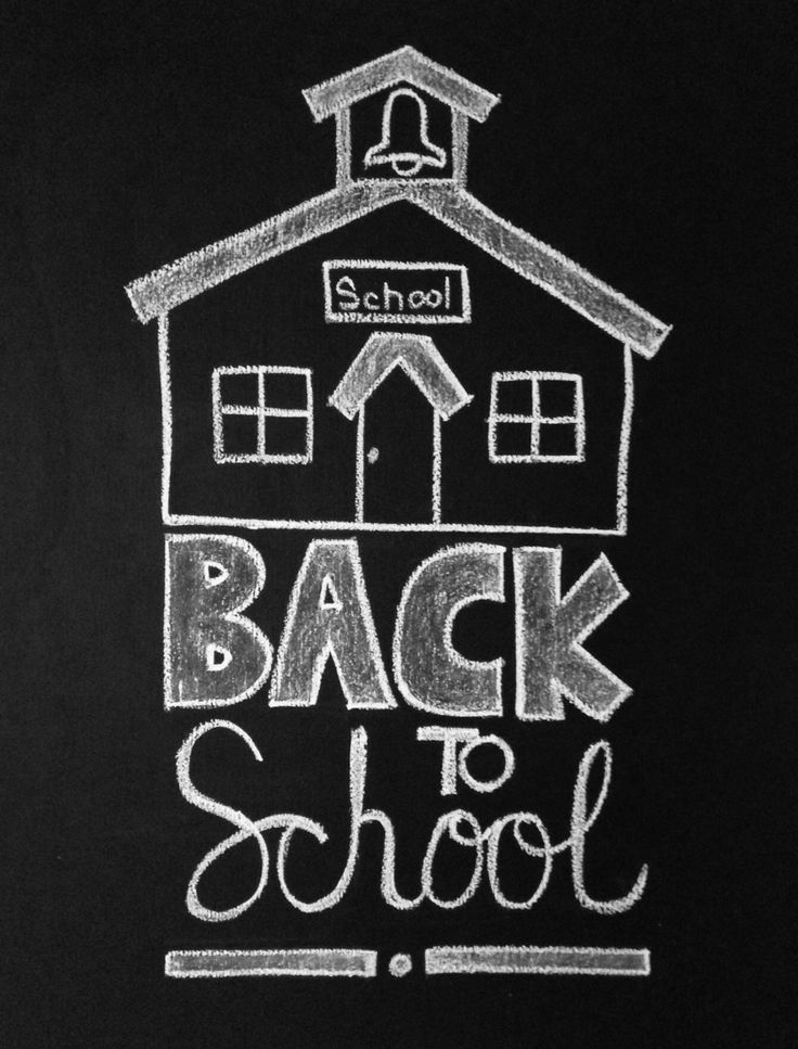 back to school written in chalk on a blackboard with a white house and clock