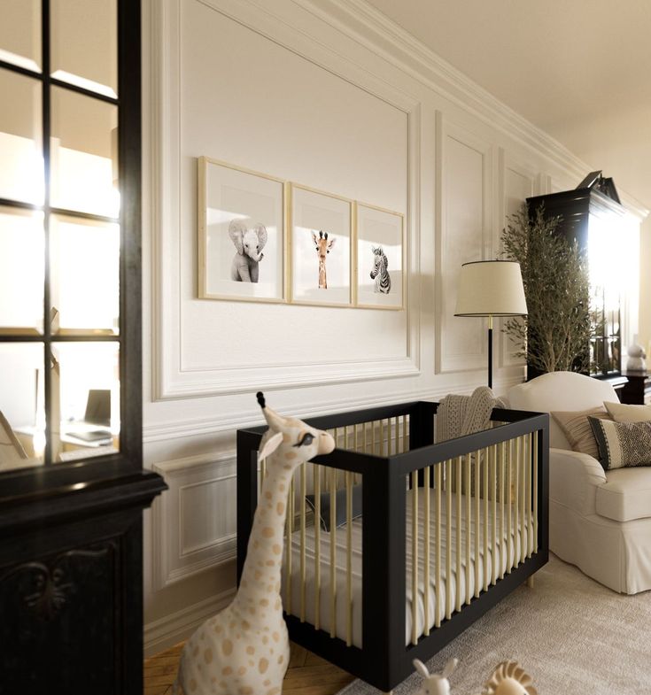 a baby's room with a giraffe statue in the corner