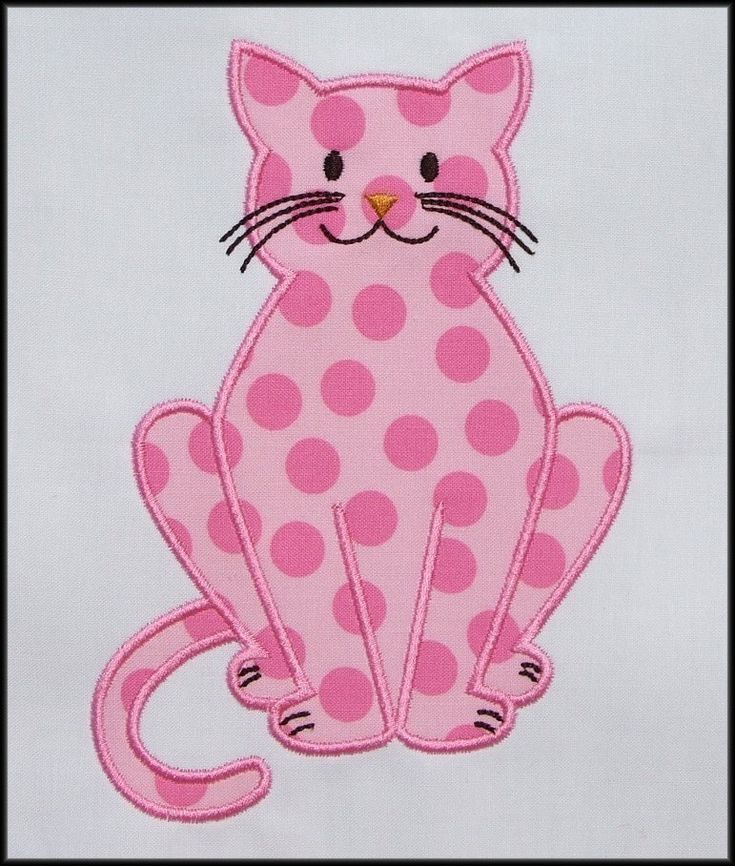 a pink and white cat with polka dots on it