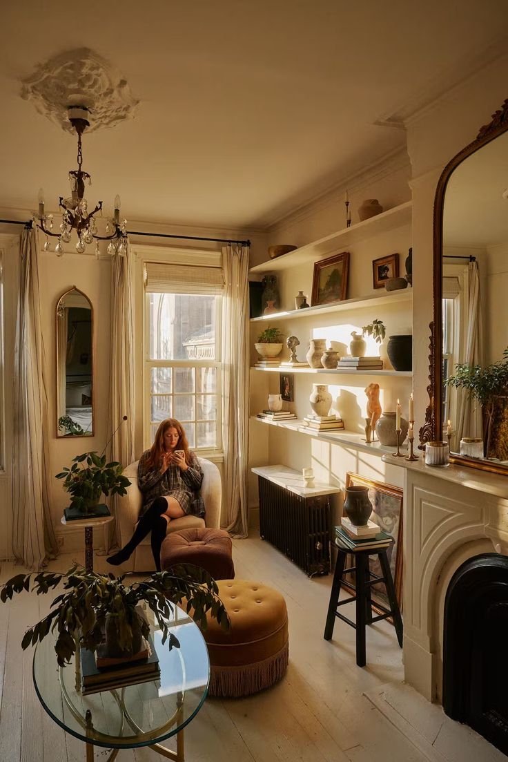 a woman sitting on a chair in a living room