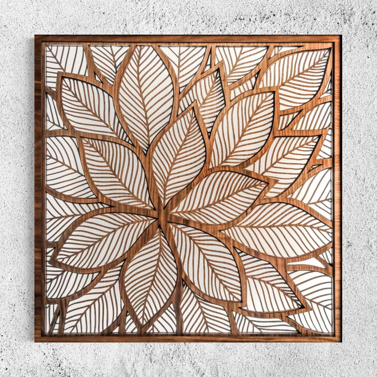 a wooden wall decoration with leaves on it