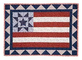 an american flag quilt with stars on it