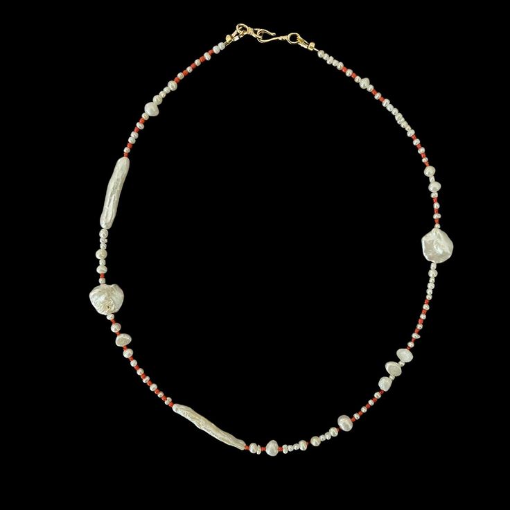 This necklace is handmade with natural baroque pearls and coral. Handmade Baroque Pearl Beaded Necklace As Gift, Handmade Beaded Baroque Pearl Necklace As A Gift, Handmade Artisan Pearl Necklace, Handmade Long Pearl Necklace, Elegant Handmade Red Coral Necklaces, Handmade Unique Baroque Pearl Necklace, Elegant Red Coral Beaded Pearl Necklace, Elegant Beaded Coral Pearl Necklace, Handmade Elegant Red Coral Necklace