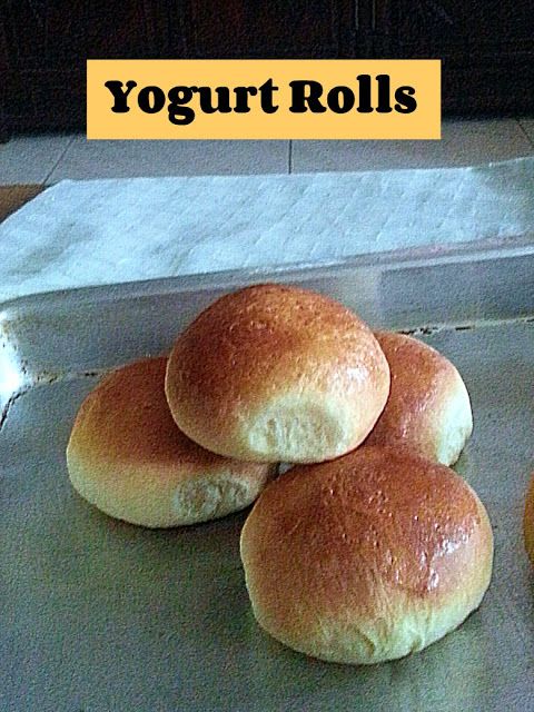 four rolls sitting on top of a metal pan