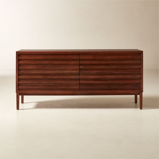 a large wooden dresser sitting on top of a white floor