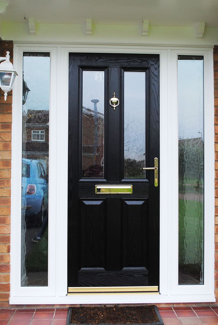 a black front door with two sidelights