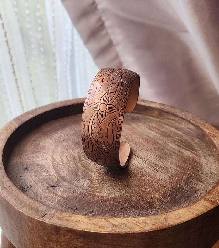 A detailed copper cuff from the 70s to 80s.  Beautiful detail and a fine example of artisan jewelry making.   Era ● 1970s Maker ● unknown Material ● copper Sizing ● 8.5" and slightly adjustable, pretty stiff Condition ● excellent b11eL Brown Stamped Copper Jewelry, Handmade Brown Bohemian Bangle, Handmade Bohemian Brown Bangle, Traditional Handmade Brown Bangle, Bohemian Handmade Brown Bangle, Vintage Hand-tooled Brown Jewelry, Vintage Brown Hand-tooled Jewelry, Handmade Brown Copper Bangle, Handmade Copper Bangle In Brown