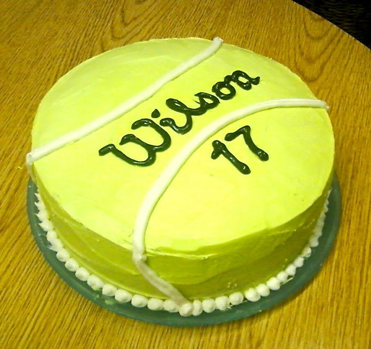 a tennis ball cake on a wooden table