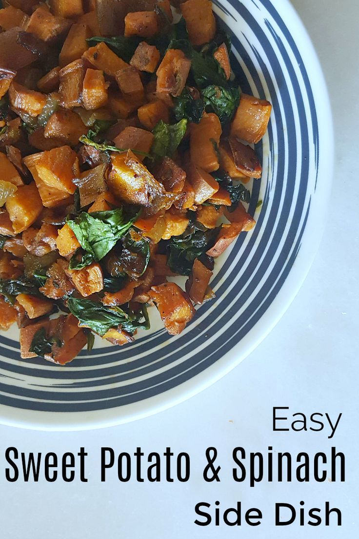 a white and blue plate topped with sweet potato and spinach side dish on top of a table