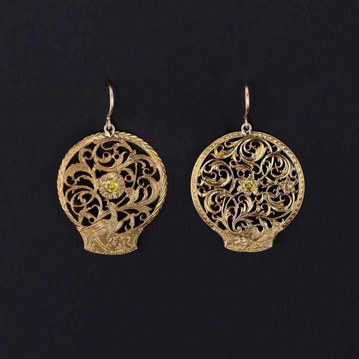 These antique earrings were created from Georgian watchcocks (circa 1780-1800) by adding yellow diamonds and 14k gold ear wires to the gold gilt (or pinchbeck) dangles. Each earring measures 1.25 inches from the top of the ear wire to bottom by 0.8 inches wide and are in great condition. We have many other fantastic offerings of period fine and costume jewelry posted on our Etsy store, so please consider browsing our other items. We send all items in individually packaged gift boxes and offer la Traditional 14k Gold Pierced Jewelry, Antique 14k Gold Hallmarked Earrings, Traditional 14k Gold Drop Earrings, Yellow Earrings With Intricate Design For Gift, Antique Earrings With 17 Jewels For Ceremonial Occasions, Victorian Filigree Oval Earrings, Victorian Oval Filigree Earrings, Antique Pendant Yellow Gold Earrings, Vintage Yellow Gold Earrings With Intricate Design