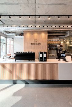 the interior of a coffee shop with lots of counter space