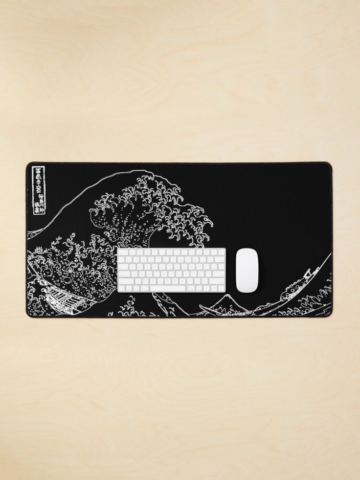 a computer mouse pad with an image of the great wave on it in black and white