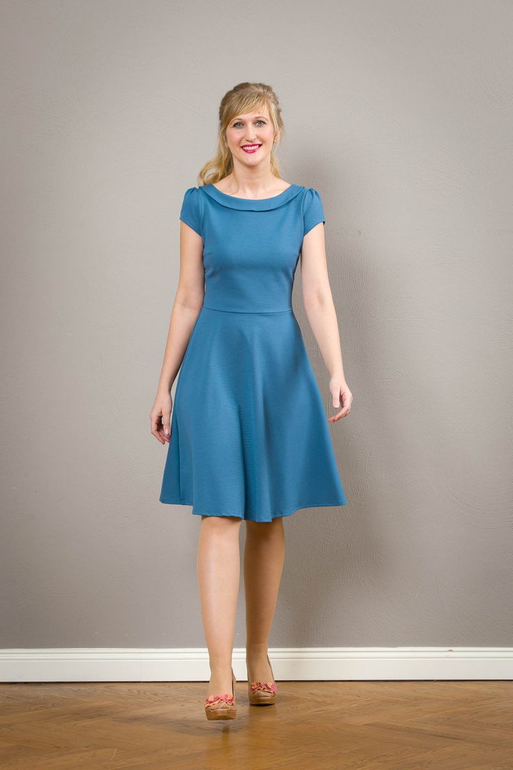 "Simple elegance! Our sheath dress Zoe is now also available with a swinging plate skirt. A fabulous dress made of fine Romanit jersey in lavender blue, with small puffed sleeves. Particularly elegant is the fine folded collar. Malva conjures up a great silhouette and accompanies you elegantly yet comfortably through the day. The waist can be emphasized very nicely with a narrow belt. (not included) Length approx. 100 cm. \"Malva\" is available in many colors. Please have a look at the color tab Fitted A-line Dress With Gathered Neckline, Classic Blue A-line Midi Dress, Classic Blue A-line Dress, Blue Fitted Dress With Gathered Neckline, Fitted Blue Dress With Gathered Neckline, Fitted Dress With Gathered Neckline In Solid Color, Fitted Solid Dress With Gathered Neckline, Blue Fitted A-line Dress, Blue A-line Fitted Dress