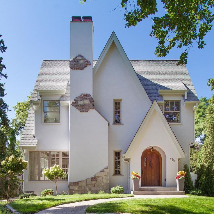 a large white house with a brown door