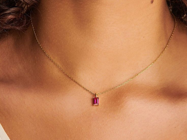 A dainty stone and delicate metallic chain are combined to create this Gold Pendant Necklace in brilliant ruby, your new favorite wear-anywhere accessory. Ruby is the birthstone of July.   D E T A I L S - Materials: 14k gold over sterling silver (Both stone setting and the chain). This necklace is 14k gold THICK plated, and it can last for a very long time with proper care. - Stone: Authentic ruby stone. Ruby is also known as July birthstone. - Pendent size: 4mm x 6mm. - Chain length: 18 inch. - Birthday Stone, Month Of July, Ring Der O, Ruby Necklace, Ruby Stone, Stone Pendant Necklace, July Birthstone, Steel Necklace, Girls Jewelry